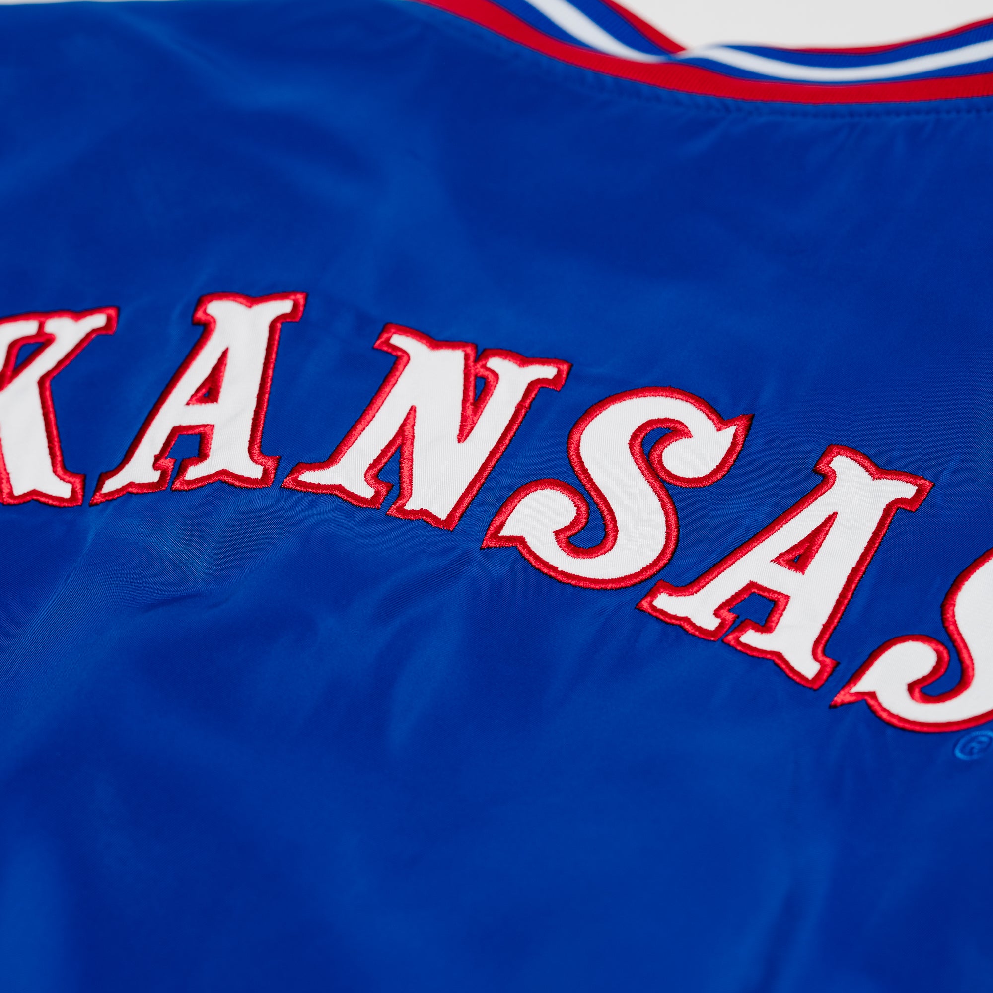 Show Your Jayhawks Pride with the Kansas Jayhawks Retro Circus Font Bomber Jacket
