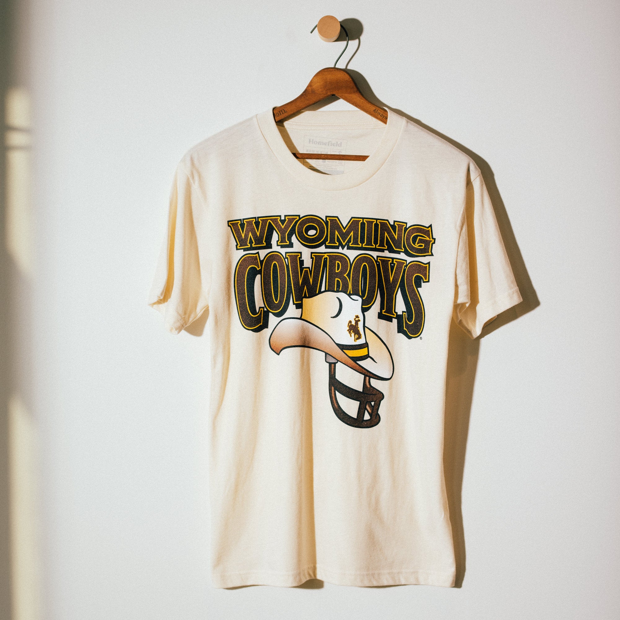 1990s Vintage Wyoming Cowboys Football Helmet Graphic Tee - Show Your Team Pride!